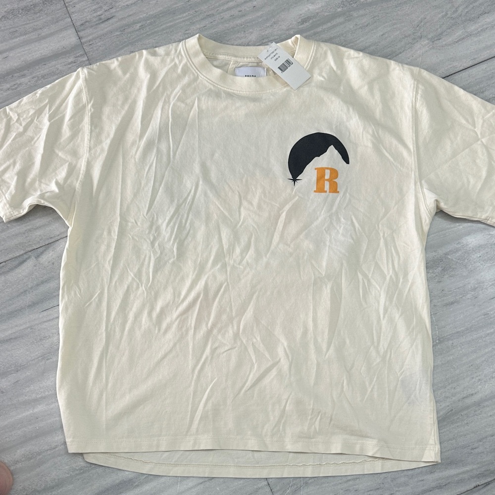 Rhude Cream Graphic Tee with Black and Orange Accents
